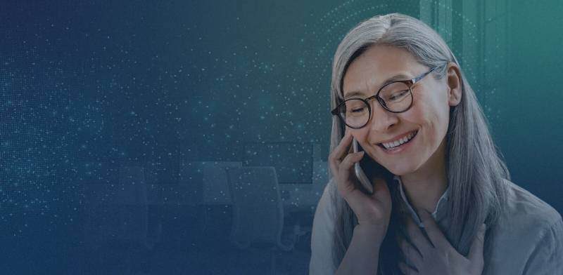 Intrado - Voice to Text - Relieved mature woman on mobile