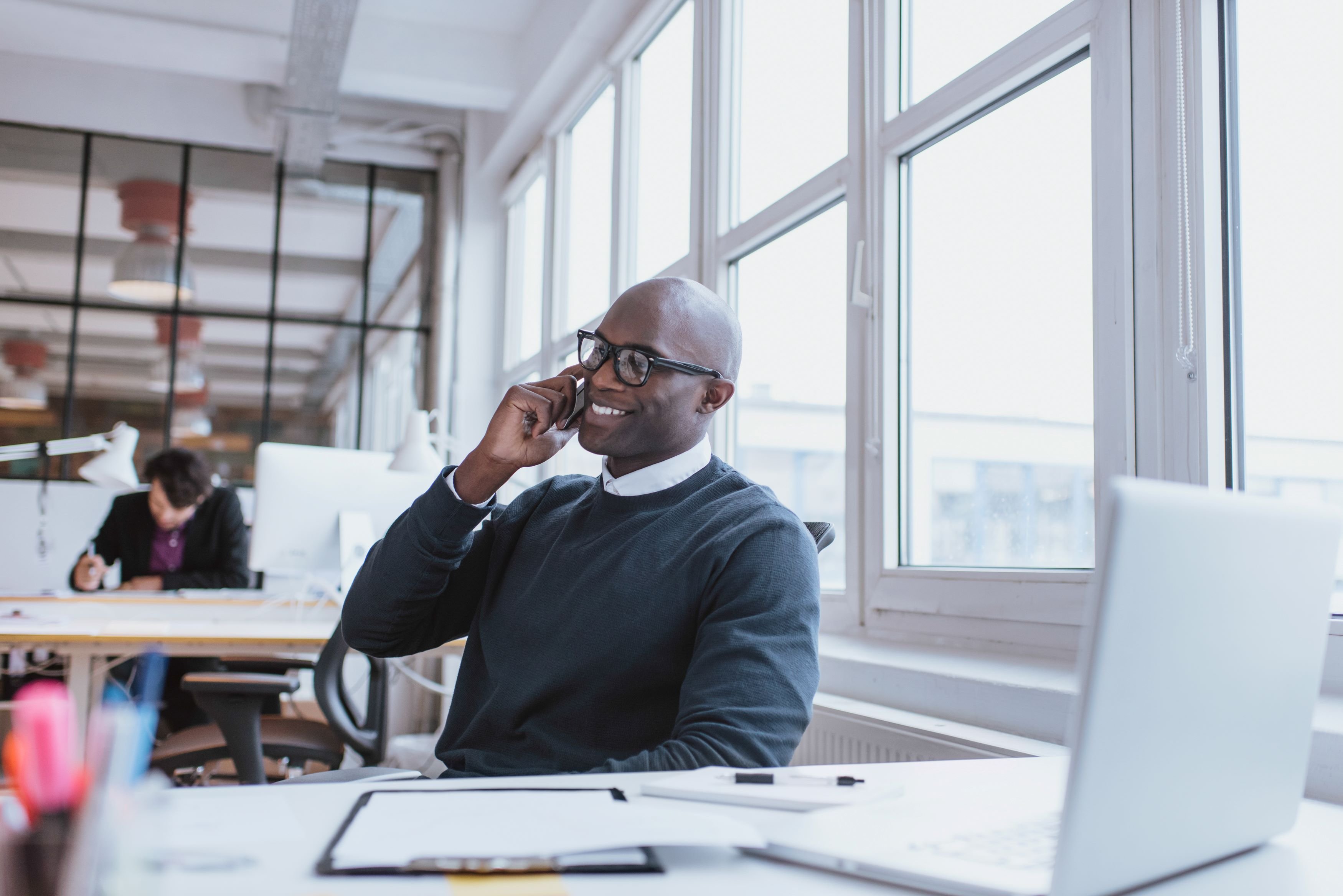 Man on Phone in Office