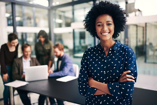 woman smiling in a conference room